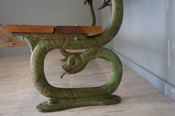 Serpent design cast iron bench
