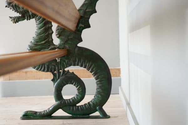 a cast iron and wood victorian style dragon bench end