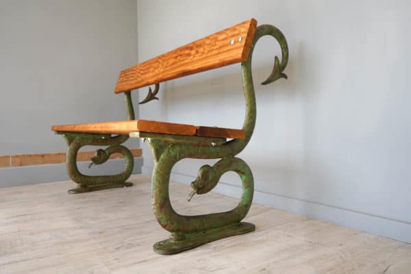 a serpent cast iron bench