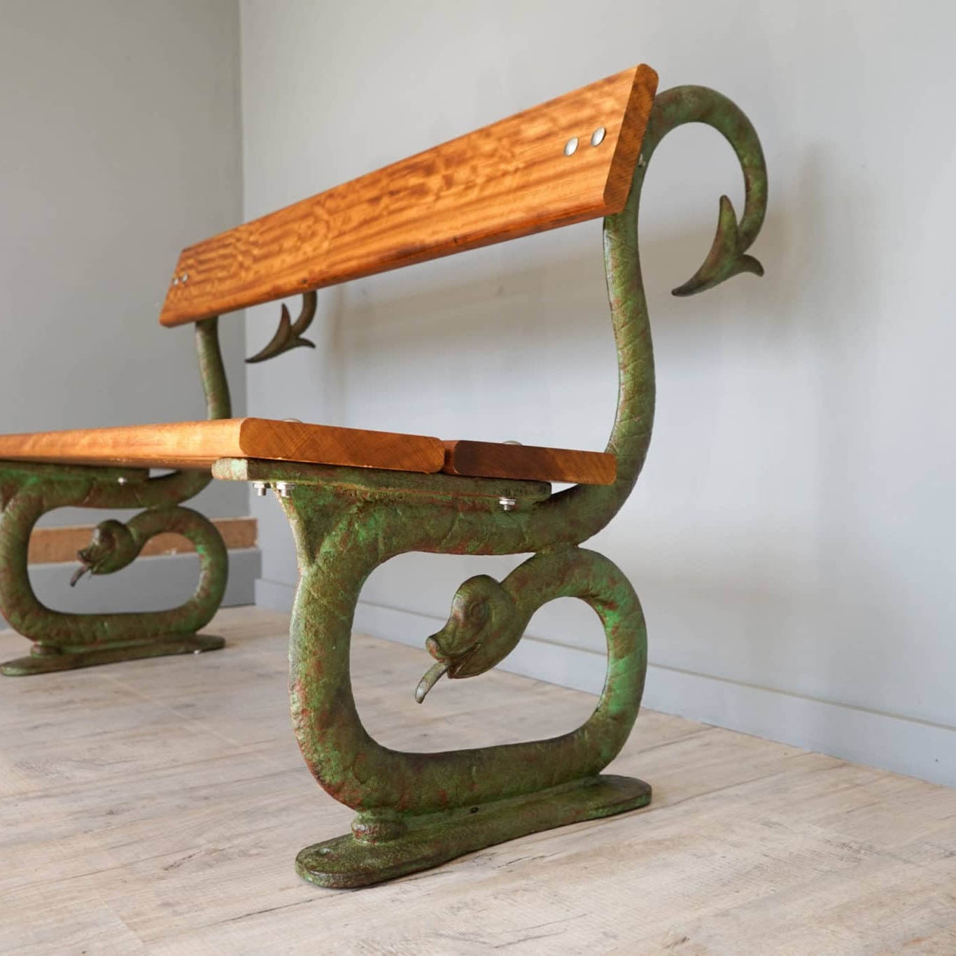 a serpent cast iron bench