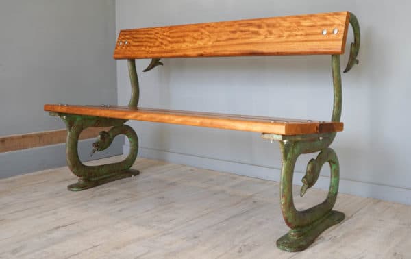 an antique cast iron garden bench