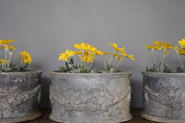 three lead foliate and flower detail plant pots