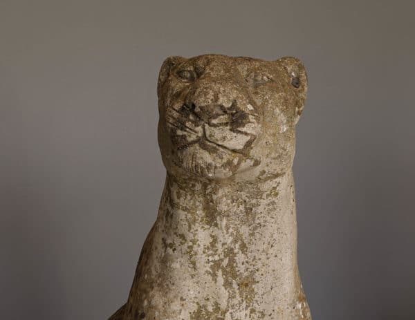 a pair an antique animal sculptures