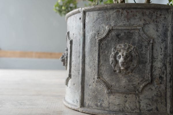 vintage lead planters with lion mask detail