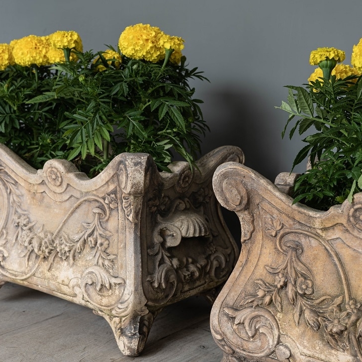 a pair of antique style garden planters