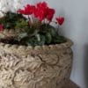 three garden planters with foliate design