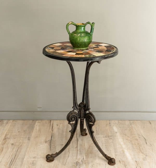 a vintage cast iron and specimen marble table