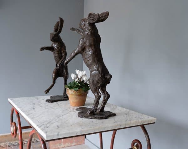 Garden or for indoors a pair of bronze boxing hares
