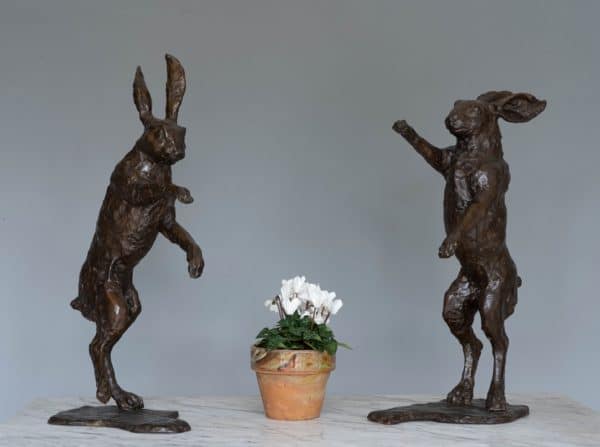 Pair of bronze boxing hares