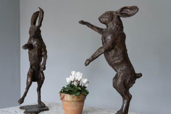 Two Bronze boxing hares