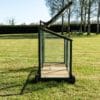 A vintage mini greenhouse on wheels