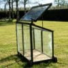 Vintage mini greenhouse on wheels