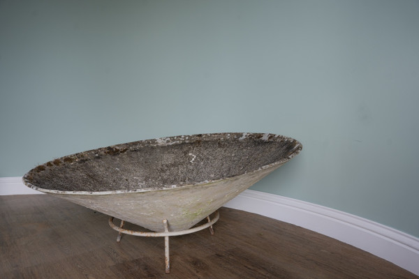 a huge circular garden planter by Willy Guhl