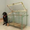 small vintage greenhouse on wheels