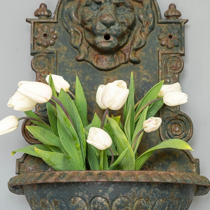 a vintage cast iron wall garden fountain