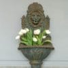 cast iron vintage wall fountain with lion mask detail