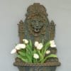 lion mask detail to cast iron wall fountain