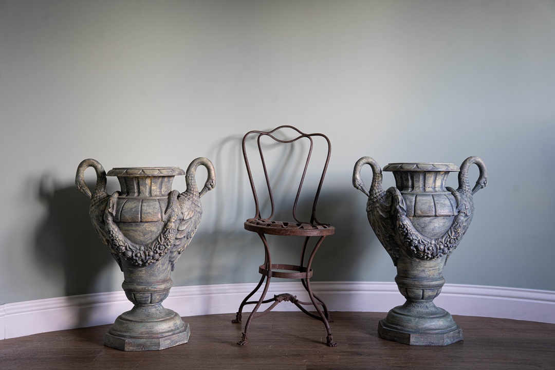 a pair of antique decorative urns for the home or garden