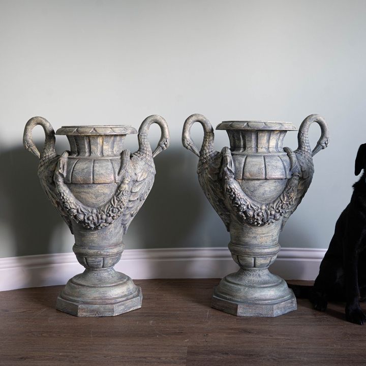 a pair of antique refurbished urns for the home or garden