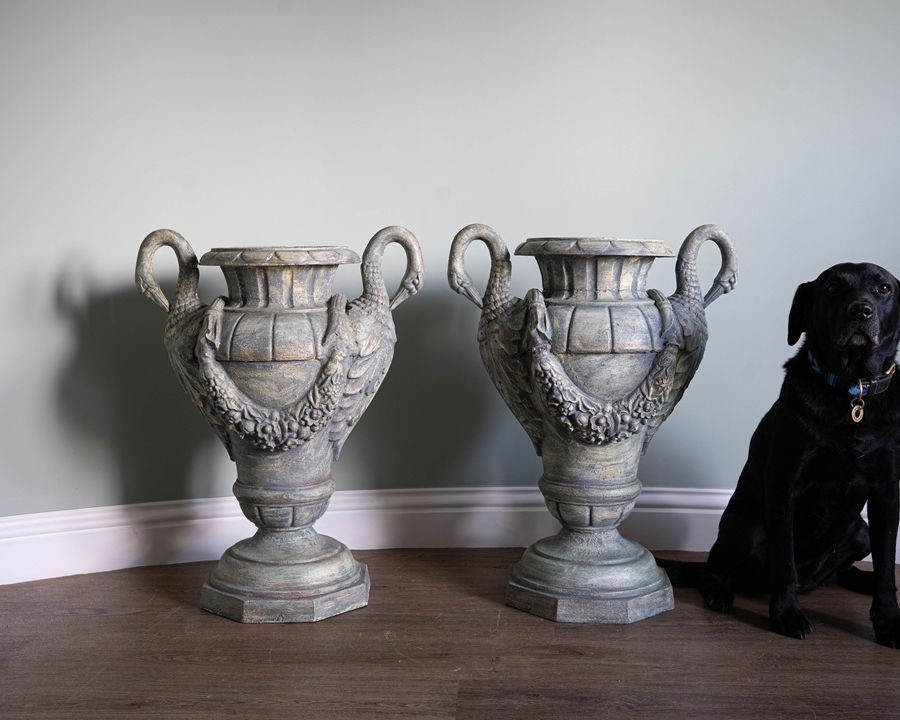 a pair of antique refurbished urns for the home or garden