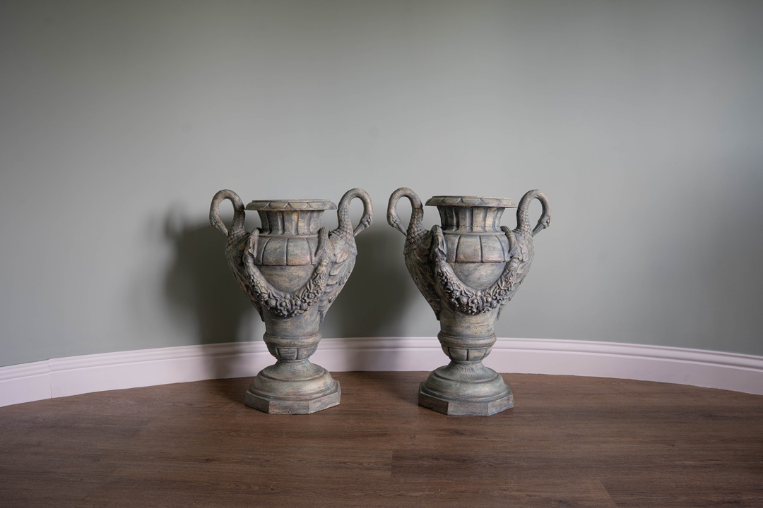 elaborate pair of antique urns for styling the garden or home