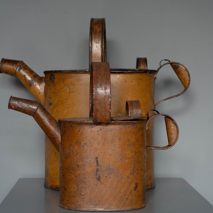 pair of vintage watering cans