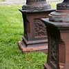 a dark coloured terracotta pair of antique garden urns from Scotland