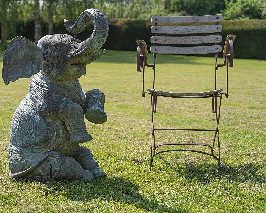antiques for the garden a bronze statue fountain and a folding chair