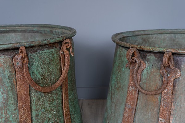 pair of garden antique copper planters or cauldrons with handles