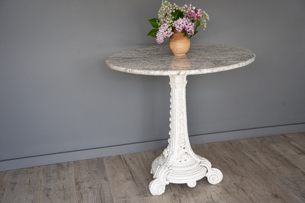 a cast iron decorative antique table