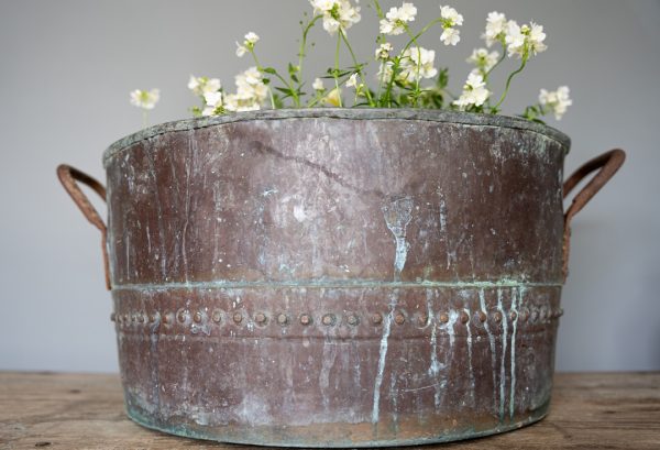 an antique copper pot