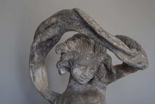 antique garden lead figure on plinth