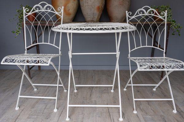a set of folding garden table and chairs