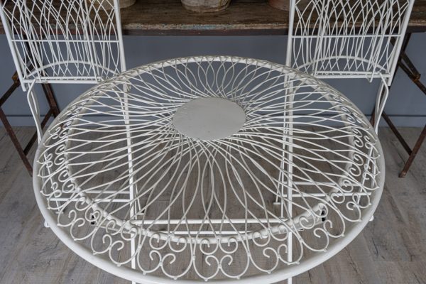a set of garden furniture comprising two chairs and table
