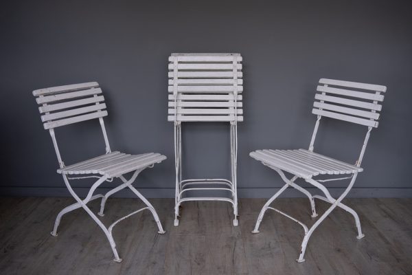 a set of vintage folding garden dining chairs