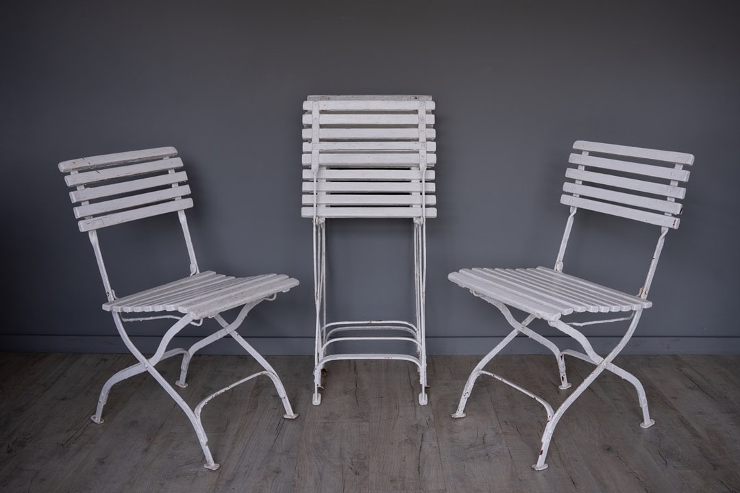 a set of vintage folding garden dining chairs