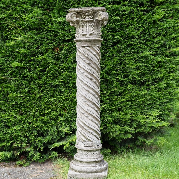 an antique decorative architectural garden column