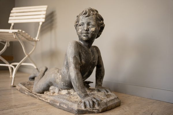 an antique garden lead statue