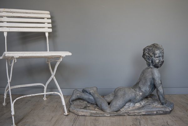 design a garden of antique statues and ornaments