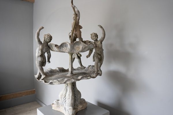 a decorative antique garden lead fountain
