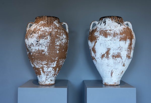 a pair of antique style terracotta olive jars