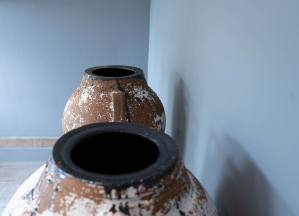 pair of white coated terracotta earthenware olive jars
