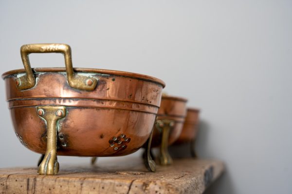 trio of copper colanders