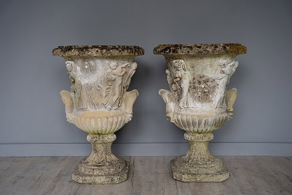 a pair of antique cast stone garden urns