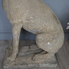 a pair of sitting garden dog hound statues