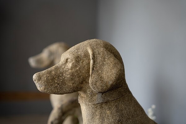 fine pair of cast stone vintage garden dog statues
