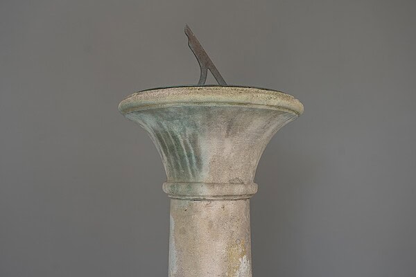 garden statement pieces of an antique garden sundial by John P White