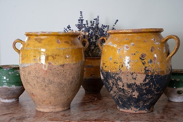 a pair of antique yellow French glazed terracotta pottery confit pots