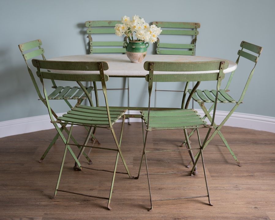 an antique garden dining table set
