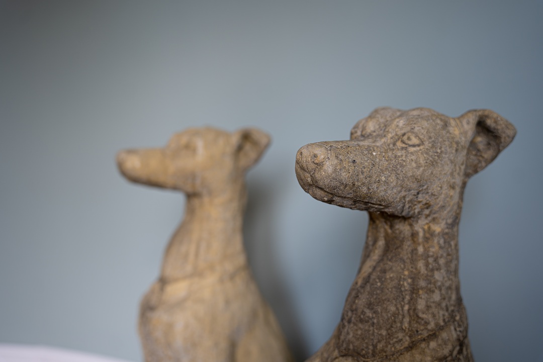 a pair of decorative garden dog statues